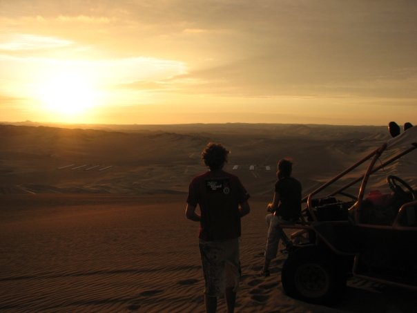 sand boarding jeep and sunset