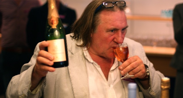 Gerard Depardieu and a glass of rose wine